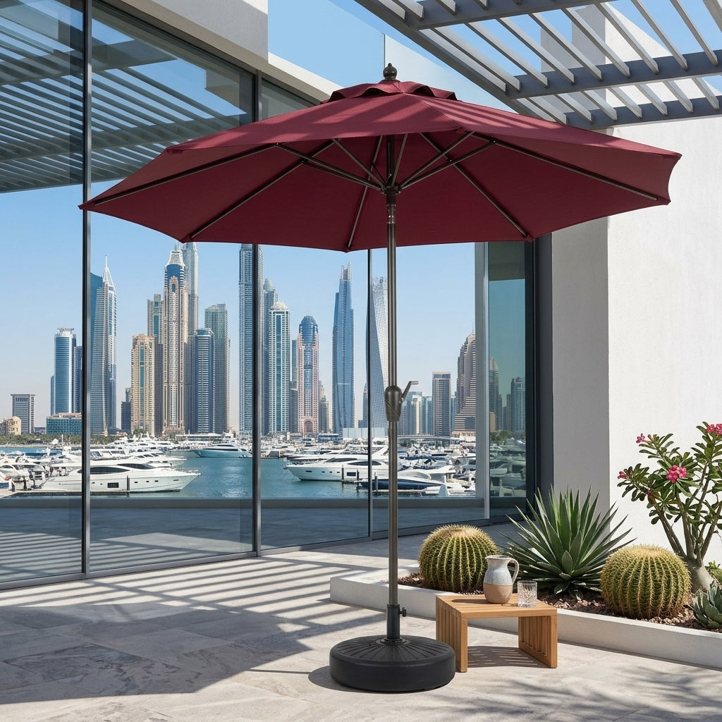 Burgundy red outdoor patio umbrella with open canopy and weighted round base