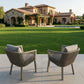 Two grey rope-weave patio dining chairs with beige cushions and aluminum frames